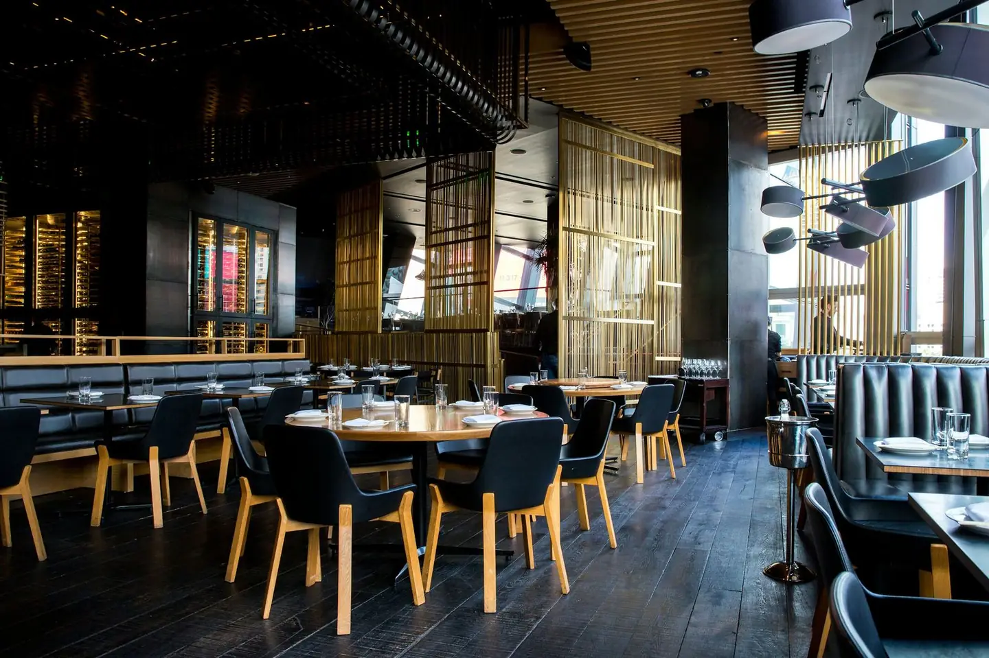 Warm wood-fired dining room at Estuario